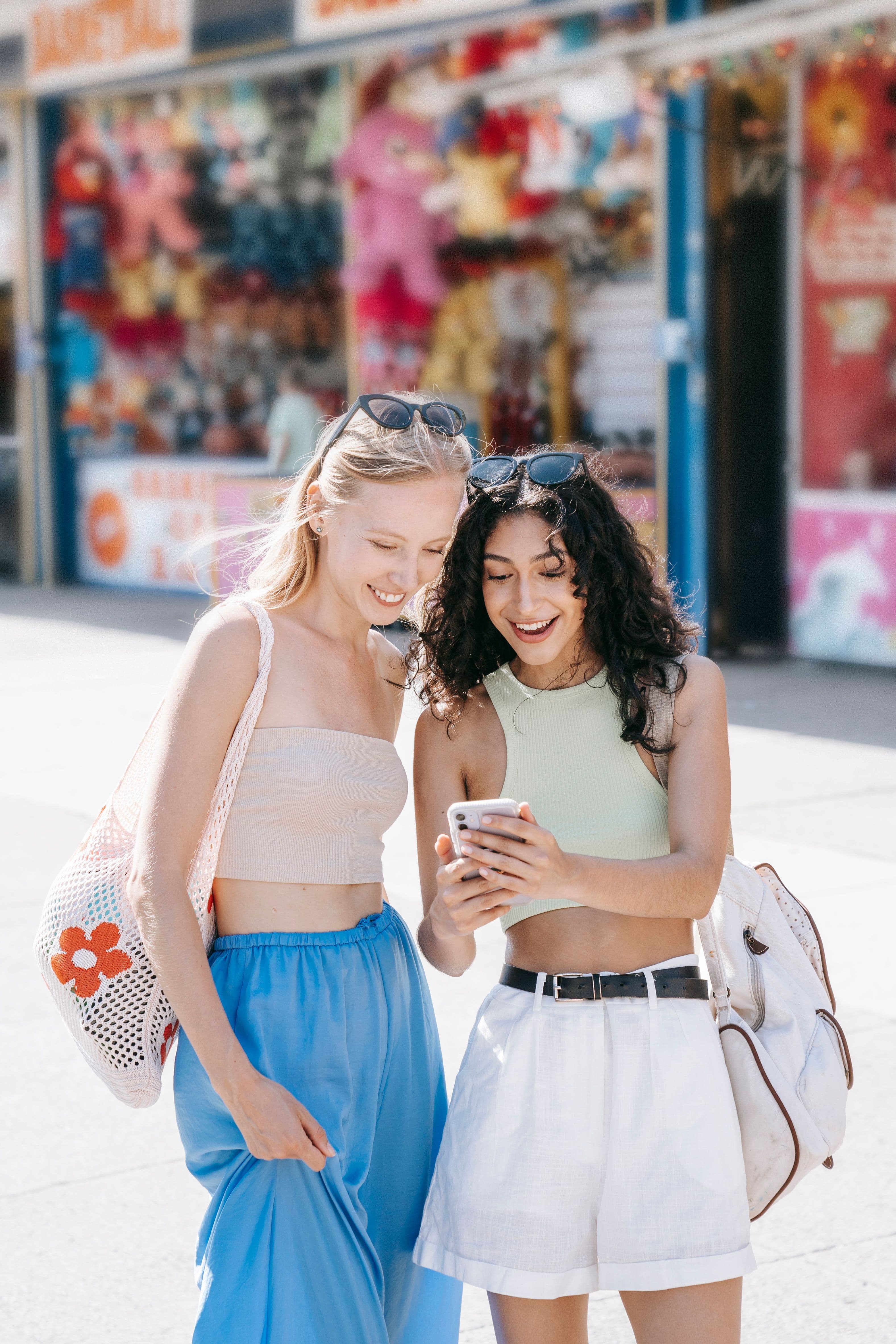 Two friends browsing gift ideas on a phone